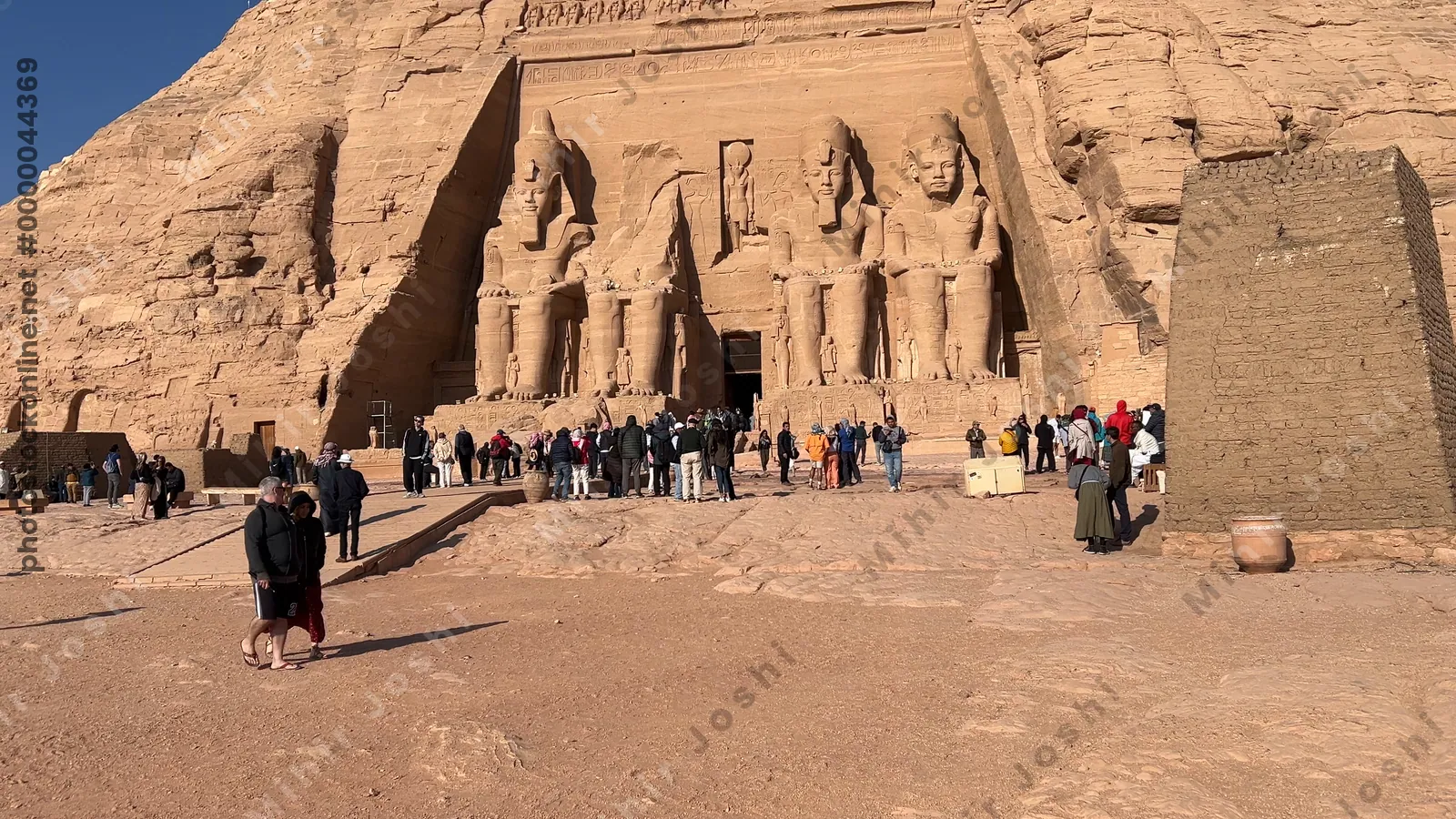 Aswan, Egypt - Feb 8, 2025: Temple of Ramesses II at Abu Simbel, Egypt, with colossal rock statues at the entrance