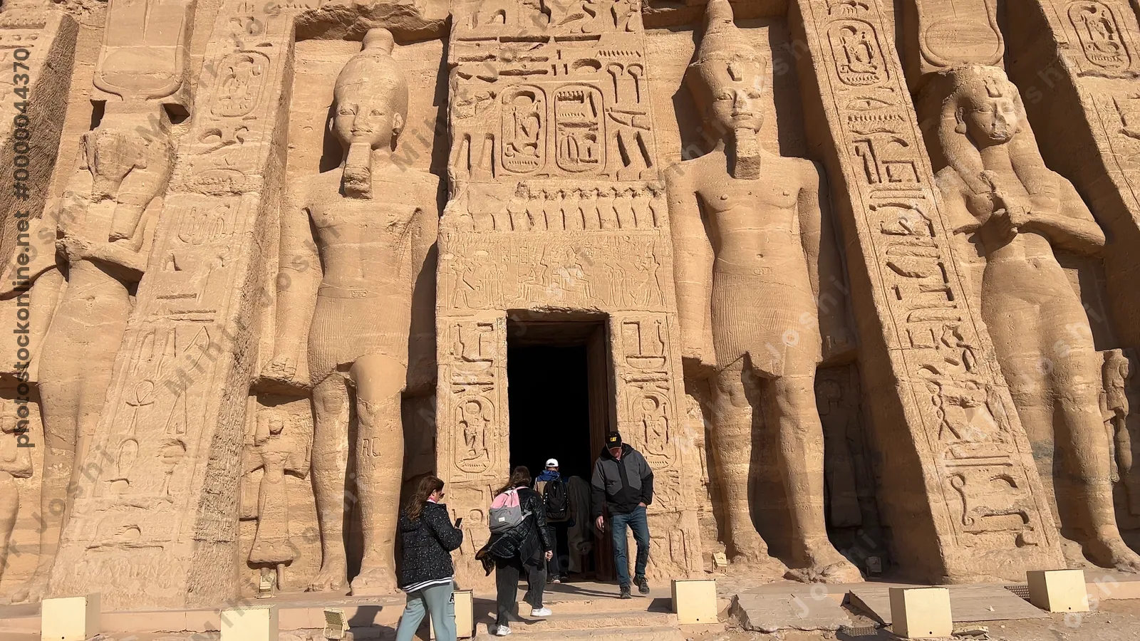 Aswan, Egypt - Feb 8, 2025: Temple of Ramesses II at Abu Simbel, Egypt, with colossal rock statues at the entrance