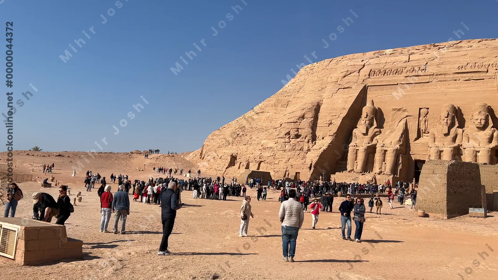 Aswan, Egypt - Feb 8, 2025: Temple of Ramesses II at Abu Simbel, Egypt, with colossal rock statues at the entrance