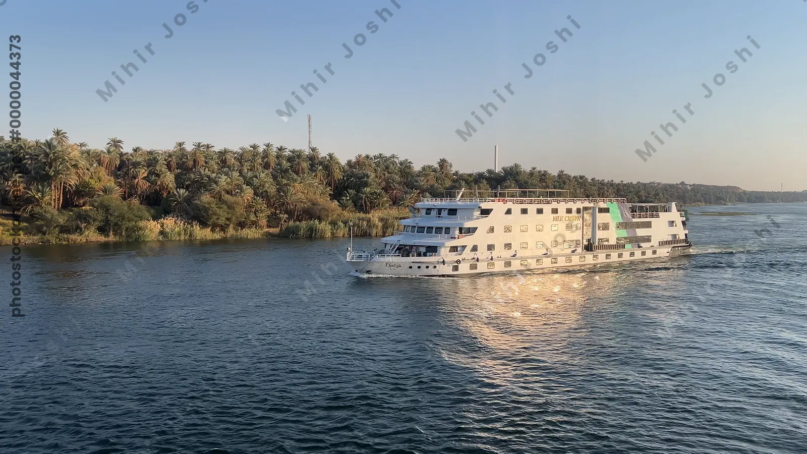 Aswan, Egypt - Feb 8, 2025: Footage from a Nile cruise ship showing another vessel sailing parallel on the river.