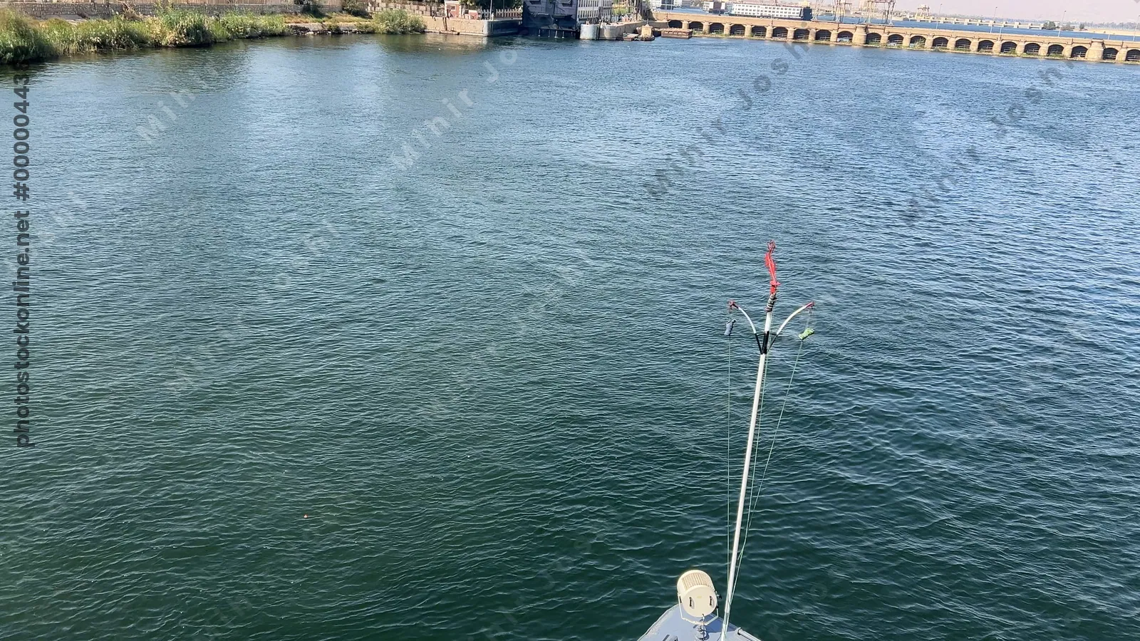 Esna, Egypt - Feb 9, 2025: Footage from a cruise ship moving along the Nile River toward the Esna Lock in Egypt, showing the river journey.