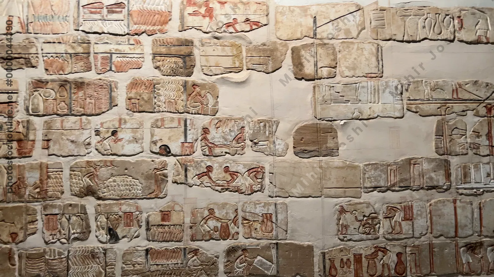 Luxor, Egypt - Feb 9, 2025: Talatat wall blocks from the temple of Amenhotep IV, composed of sandstone, depicting storage of goods in the temple, 18th Dynasty, New Kingdom, Luxor Museum.