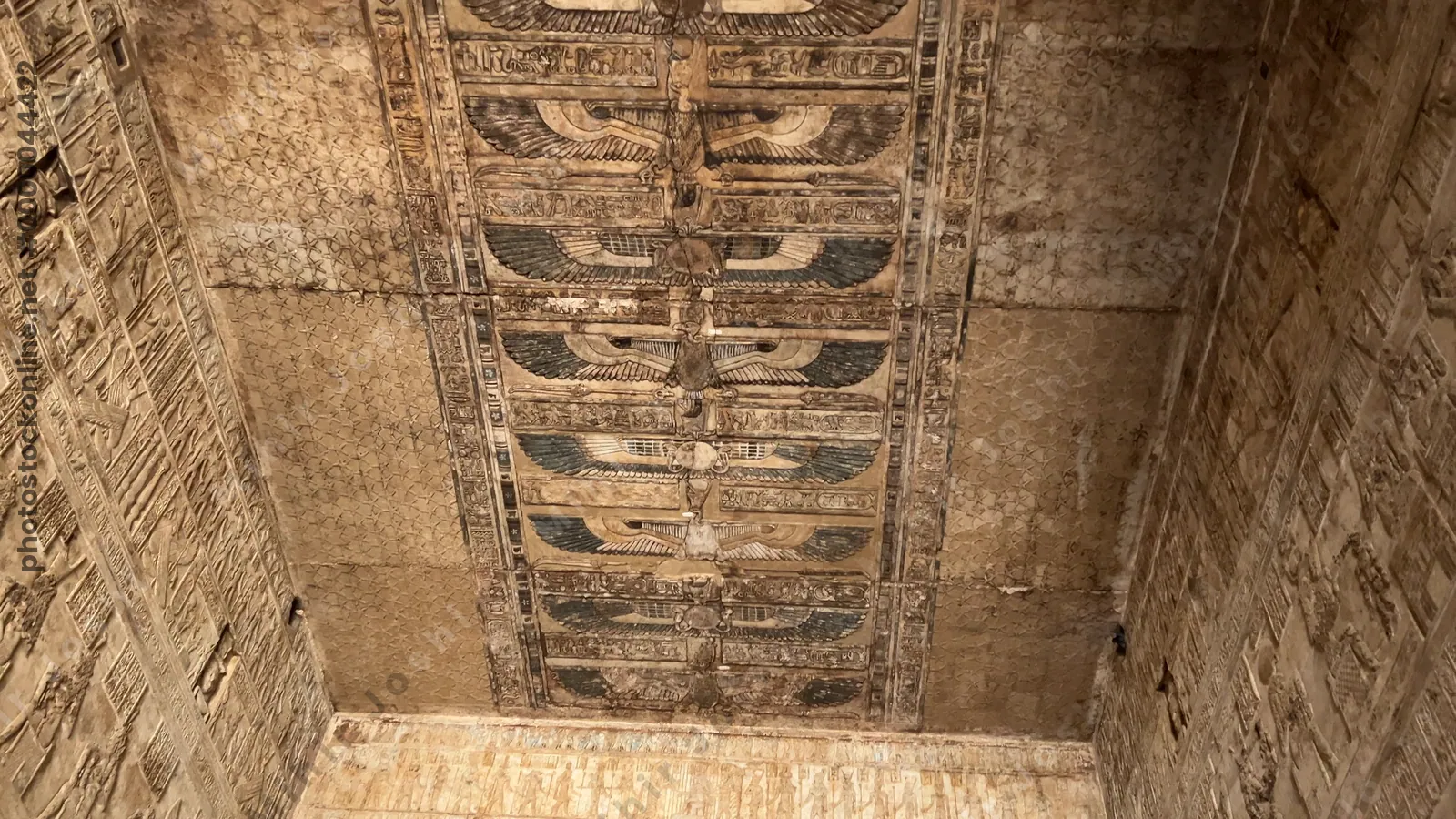 Dendera, Egypt - Feb 10, 2025: Footage of the decorated stone roof with carvings and hieroglyphs inside the Temple of the Mammisi, or Birth House, at Dendera in Egypt.