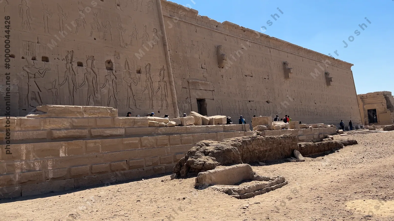 Dendera, Egypt - Feb 10, 2025: Wide footage showing the ancient Dendera Temple complex with monumental structures, ruins, and open courtyards in Egypt.