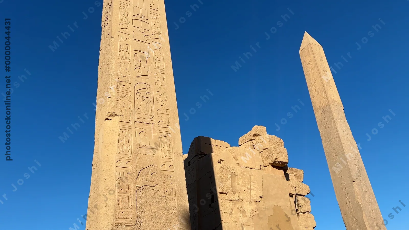 Luxor, Egypt - Feb 10, 2025: Footage of the two ancient obelisks standing tall inside the Karnak Temple complex in Luxor, Egypt.