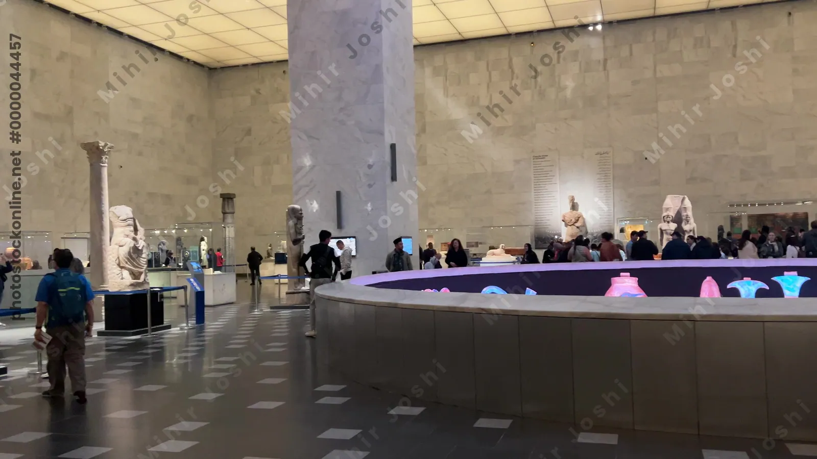 Cairo, Egypt - Feb 12, 2025: Visitors inside the National Museum of Egyptian Civilization in Cairo, Egypt, viewing ancient statues, artifacts, and archaeological exhibits of pharaonic heritage.