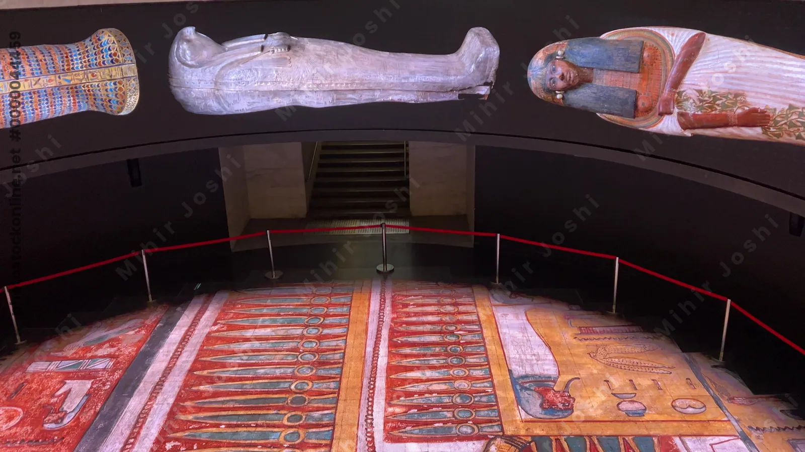 Cairo, Egypt - Feb 12, 2025: LED screens displaying images of ancient Egyptian mummies and coffins inside the National Museum of Egyptian Civilization, a cultural landmark in Cairo.