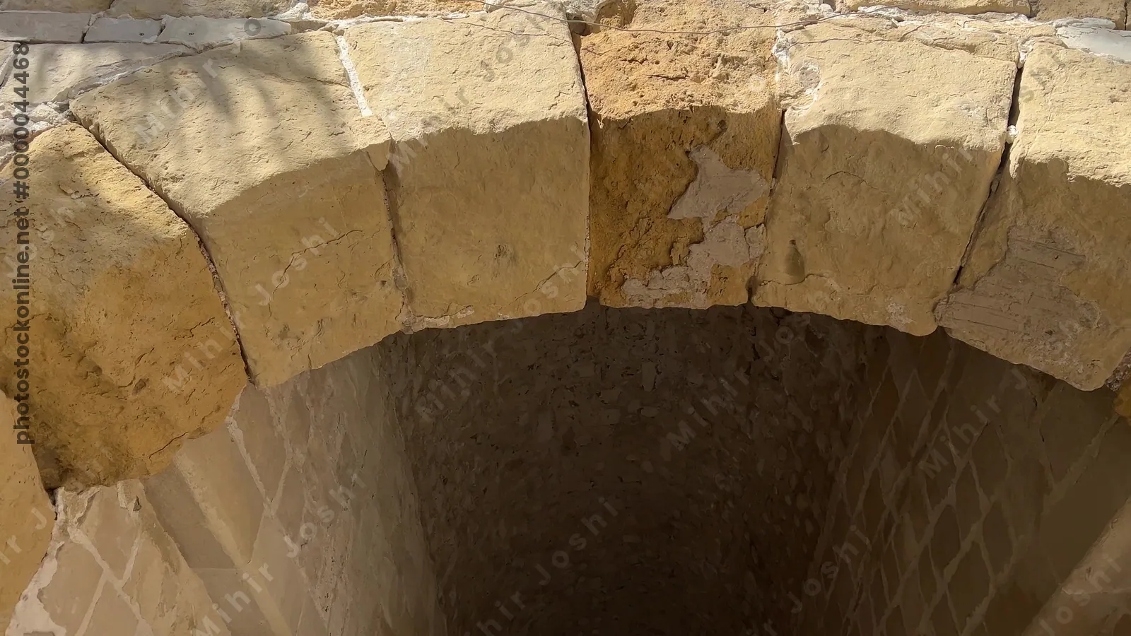 Alexandria, Egypt - Feb 13, 2025: Visitors pass through the inner gate into the courtyard of the Citadel of Qaitbay, a medieval fortress and major historic landmark.