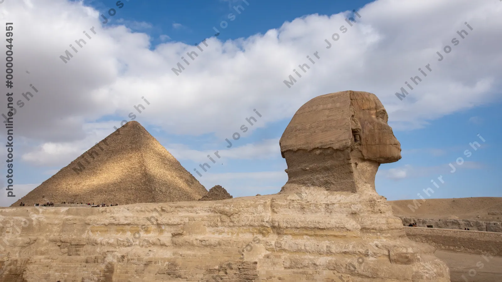 Giza, Egypt - Feb 6, 2025: The Great Sphinx of Giza with the iconic Great Pyramid in the background, a timeless view of ancient Egyptian grandeur.