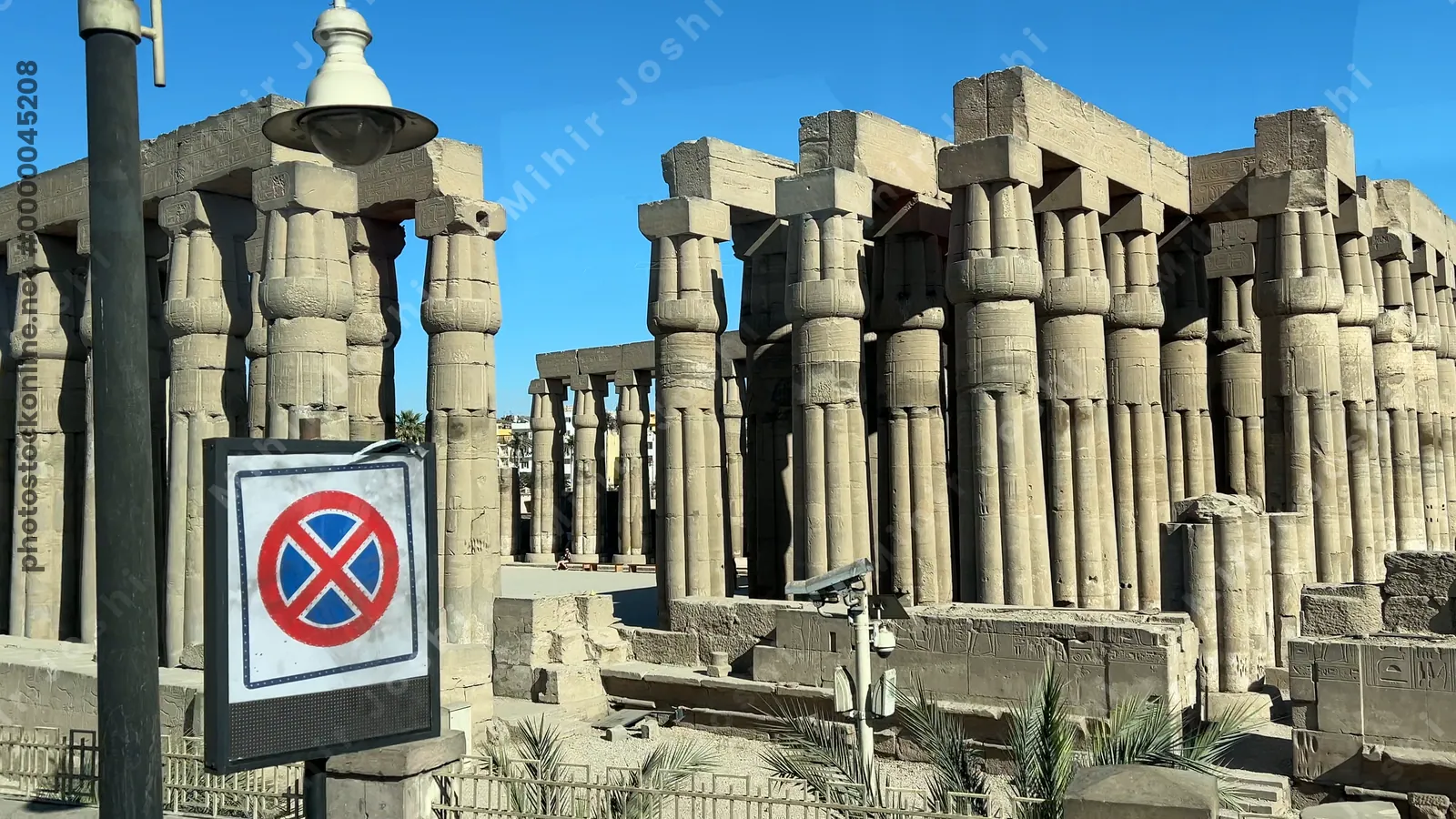 Luxor, Egypt - Feb 10, 2025: Footage of Karnak Temple complex as seen from a moving bus, with ancient ruins and monumental structures in view.